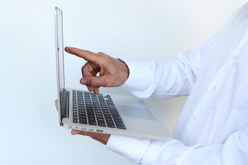 businessman in a white shirt with a laptop in hand, close-up, copy space