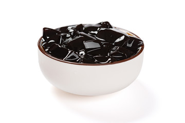 bowl of Licorice black jelly on white clipping path