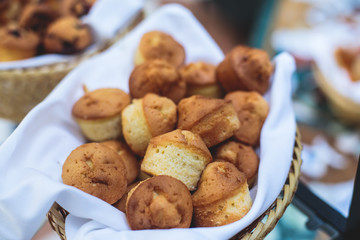 Beautifully decorated catering banquet table with variety of different pastry and bakery, with croissants and cookies on corporate christmas birthday party event or wedding celebration