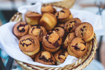Beautifully decorated catering banquet table with variety of different pastry and bakery, with croissants and cookies on corporate christmas birthday party event or wedding celebration