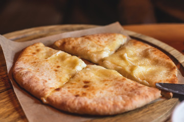 Process of cooking and serving traditional georgian food cuisine, with pkhali khinkali dumplings and khachapuri