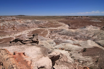Badlands of the Painted Desert in Petrified Forest National Park, Arizona, under a cloudless summer...