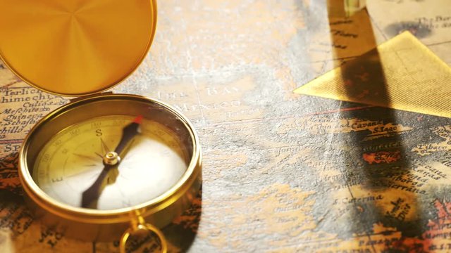 Bermuda triangle marked with golden ink on a vintage map. Compass malfunction.