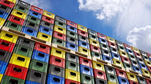 Loop of countless colorful beer crates stacked in an outdoor warehouse. 4KHD