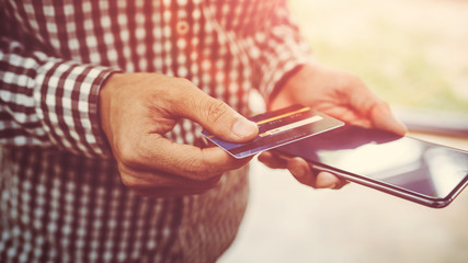 Young man hand holding a credit card.