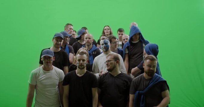 GREEN SCREEN CHROMA KEY Front view group of people fans wearing blue clothes watching a sport event. 4K UHD ProRes 422 HQ
