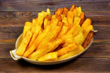 French fries popular food and snack - is a piece of potatoes, fried in a large amount of strongly heated vegetable oil or animal fat, sometimes used egg white.