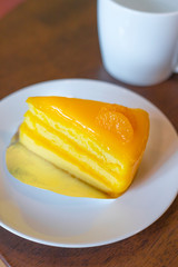 Orange Cake on white dish.