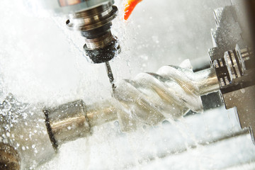 Obraz na płótnie Canvas CNC milling machine work. Coolant and lubrication in metalwork industry