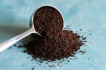 Ground Coffee Spilled from a Coffee Scoop