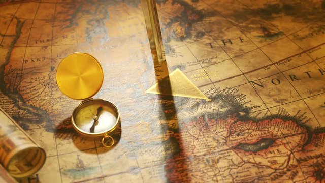 Bermuda triangle marked with golden ink on a vintage map. Compass malfunction.