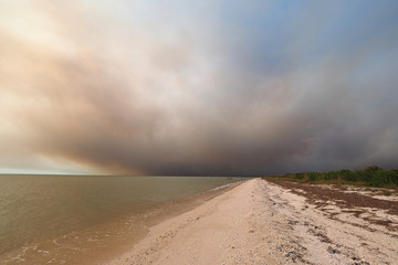Smoke from a wildfire over the beach and Gulf of Mexico on East Cape Sable in Everglades National Park, Florida.