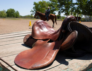 horse saddle, blurred background of people