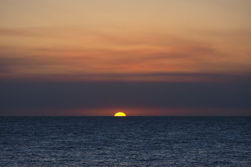 The setting sun under a blanket of wildfire smoke over the Gulf of Mexico off East Cape Sable in Everglades National Park, Florida.