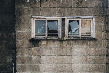 Broken glass and block wall