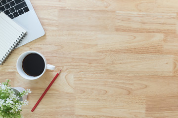 Flay lay, Top view office table desk with smartphone, keyboard, coffee, pencil, leaves with copy space background.