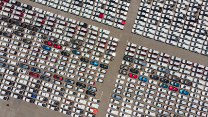 Aerial Top view of new cars lined up at Industrial factory Port, Logistics import - export and transportation concept © Travel mania