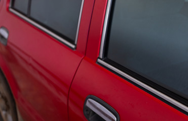 Side doors of red car