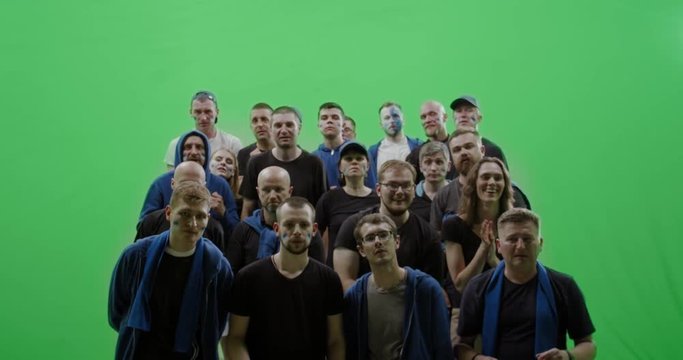 GREEN SCREEN CHROMA KEY Front view group of people fans wearing blue clothes celebrating during a sport event. 4K UHD ProRes 422 HQ