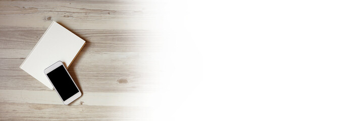 Book and smartphone on the table or desk. テーブルの上の本とスマートフォン	