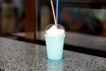 girl with a perfect manicure on her fingers holds a glass with a cold milk drink 
