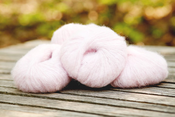 Balls of Yarn on Wooden Table   