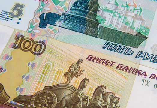Money. Russian rubles. Notes in denominations of five, and one hundred rubles of the Russian Federation. Cash. Background texture. Rub. Close up. Macro shooting.