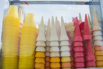 stack of colorful dirty ice cream cones background