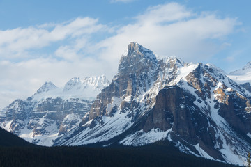 Jagged mountain peaks partially covered with snow
