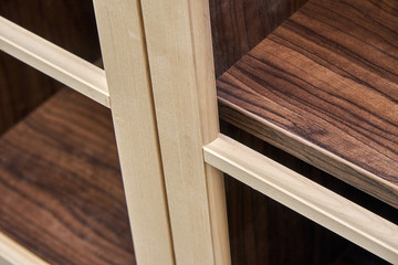 Wooden cabinet doors. Wooden frame. Home library with classic design. Wooden furniture manufacturing process