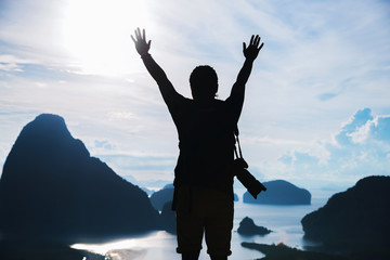Fototapeta premium Men travel photography on the Mountain. Tourist on summer holiday vacation. Landscape Beautiful Mountain on sea at Samet Nangshe Viewpoint. Phang Nga Bay, Travel Thailand, Travel adventure nature.