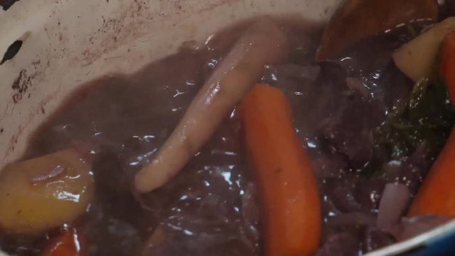 Beef bourguignon, putting the meat on the fried onions