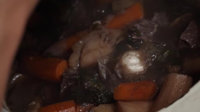 Beef bourguignon, putting the meat on the fried onions