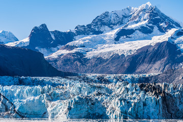 Johns Hopkins Glacier, a 12 mile long glacier in Glacier Bay National Park and Preserve, Alaska. Captured October 2017. Mount Orville and Mount Wilbur ice/snow covered peak mountains in background.