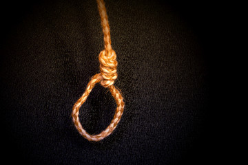 Loop on the end of a jute rope on a black background
