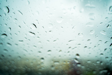 Rain drops on the windshield In the evening when heavy rain