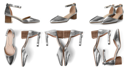 Set of stylish silver female shoes on white background