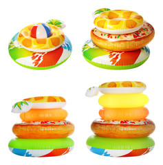 Set of bright inflatable rings on white background