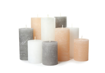 Many color wax candles on white background