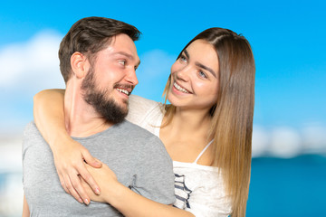 Fototapeta premium Happy couple embracing and looking at camera