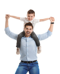 Portrait of dad playing with his son isolated on white