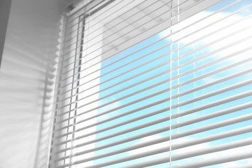 Closeup view of window with horizontal blinds, low angle view
