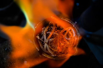 smelting precious metal of silver or gold. remelting of jewelry in a crucible with a torch at a...