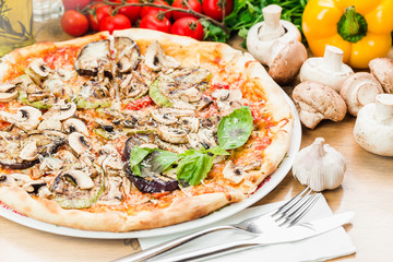 From above shot of cheesy crispy pizza with mushrooms