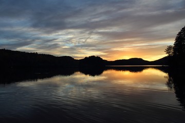 Fototapeta premium Blue, orange, yellow, sunset on lake