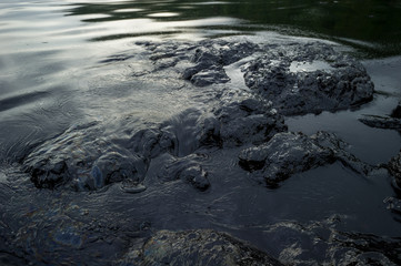 Fototapeta na wymiar Oil sludge contaminating the sea during the oil spill disaster in Samet Island, Rayong, Thailand.