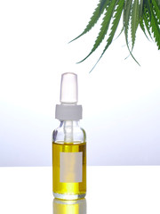 Cannabis with extract oil in a bottle