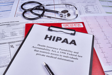 Health Insurance Portability and accountability act HIPAA, red folder with inscription...