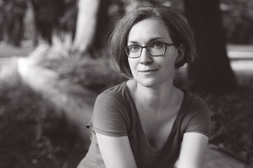 beautiful portrait of a girl with glasses. rest in the park