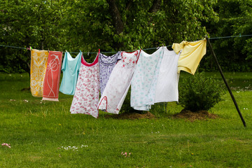 Countryside outdoor park view of drying clothes in a wind.